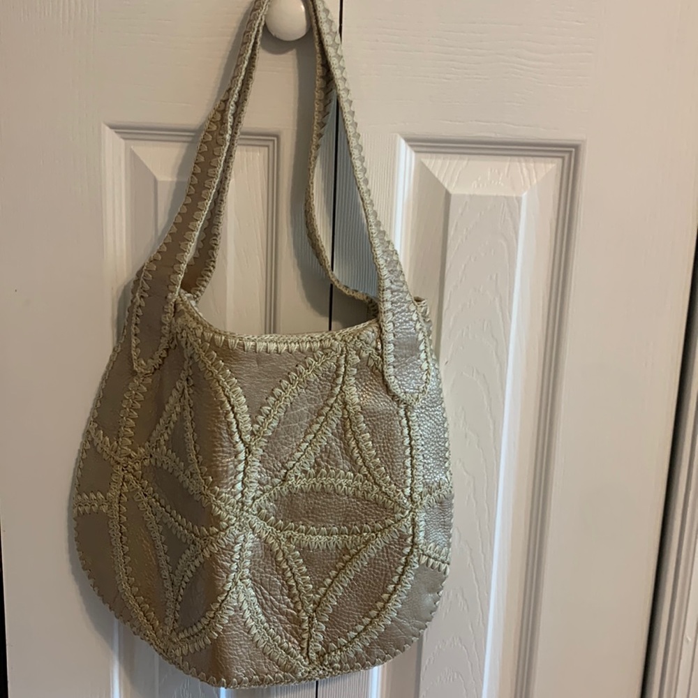 The Sak gold shoulder bag. Great condition.